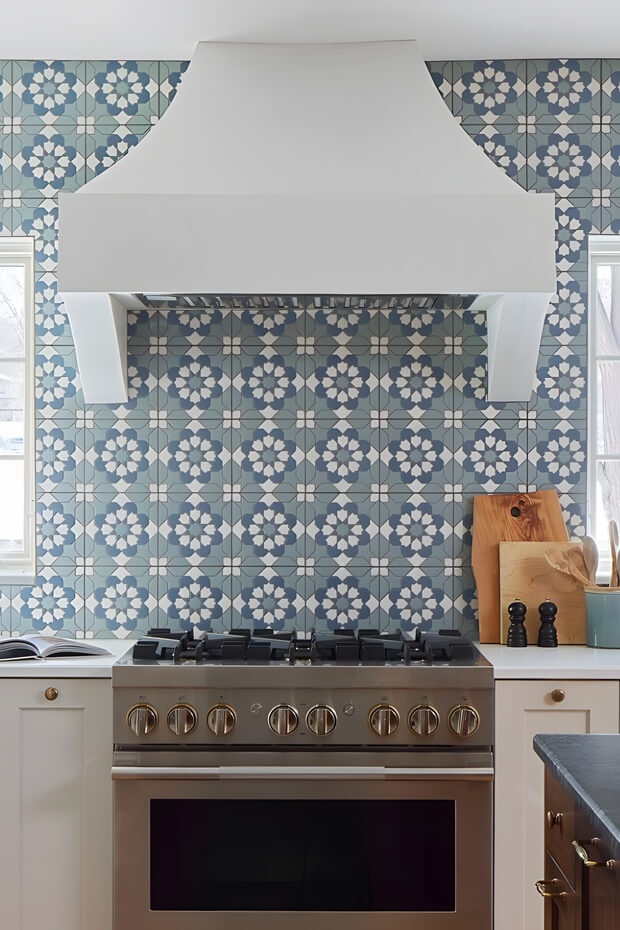 Blue and white geometric ceramic kitchen backsplash tiles with repeating pattern