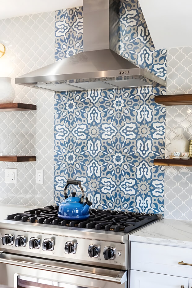 Blue and white hexagonal patterned ceramic kitchen backsplash tiles with intricate details