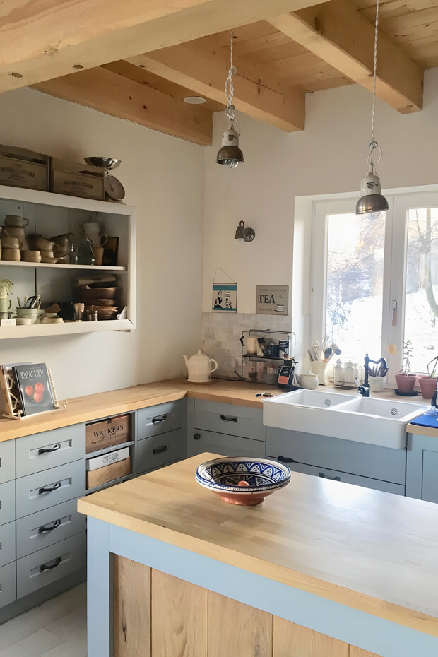 Countryside kitchen with wooden island and cabinets
