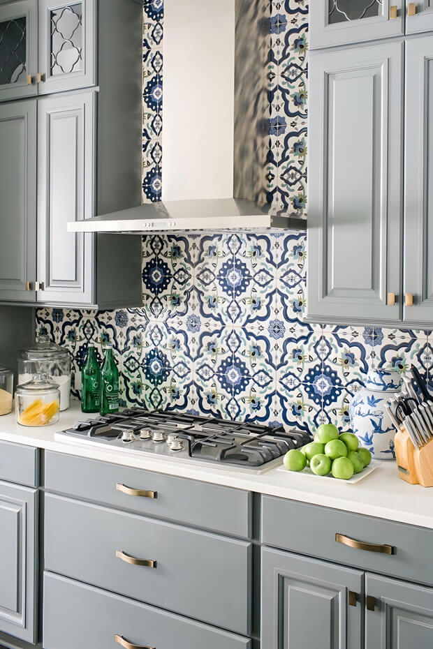 Blue and white geometric ceramic kitchen backsplash tiles with intricate pattern